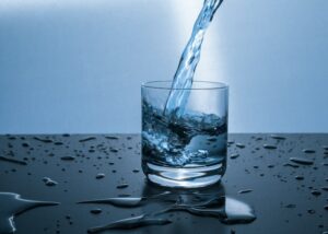 Water being poured into glass cleaned by Houston reverse osmosis water filter